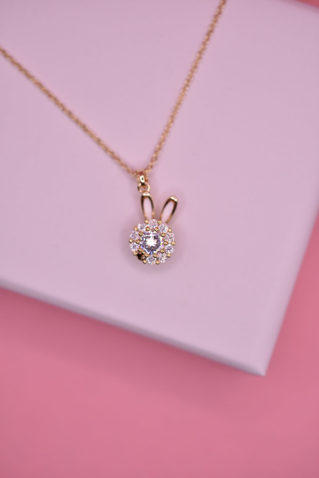 Dije giratorio conejito